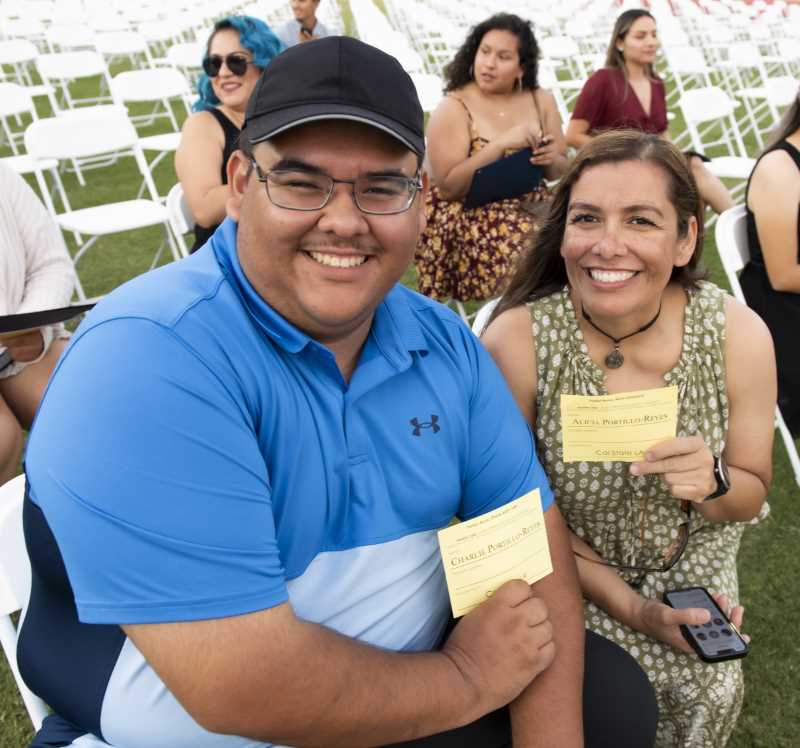 Husband and wife transferring graduates